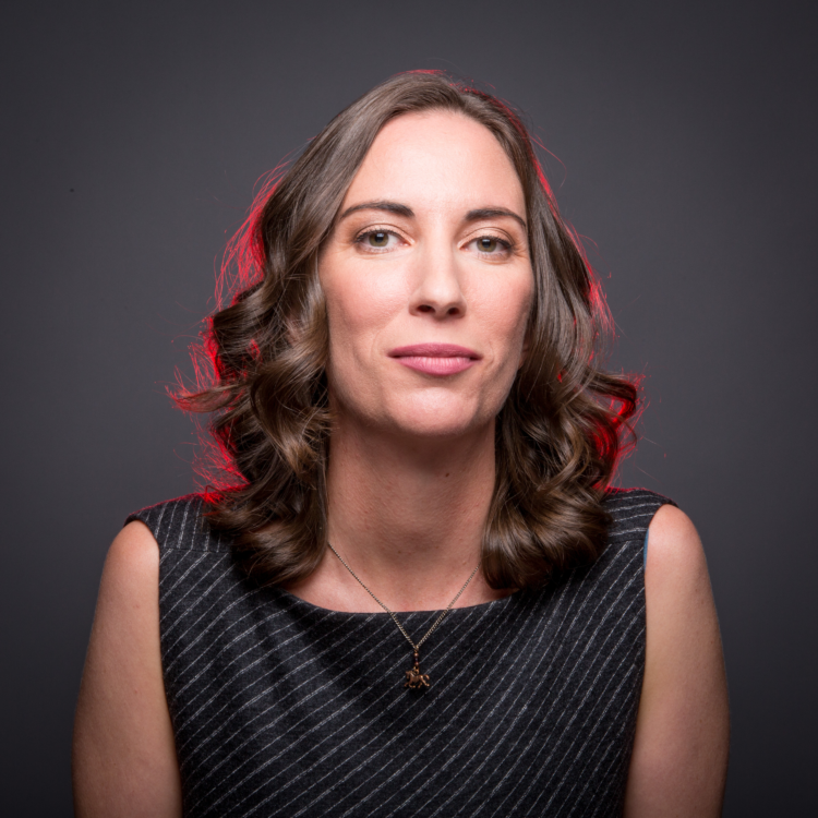 Rebecca smiling and looking straight into the camera